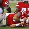 UNLV quarterback Nick Sherry holds his neck after getting hit above the shoulders by Washington State during their game Friday, Sept. 14, 2012 at Sam Boyd Stadium. Washington State won the game 35-27, dropping UNLV to 0-3 on the season. UNLV quarterback Nick Sherry holds his neck after getting hit above the shoulders by Washington State during their game Friday, Sept. 14, 2012 at Sam Boyd Stadium. Washington State won the game 35-27, dropping UNLV to 0-3 on the season.